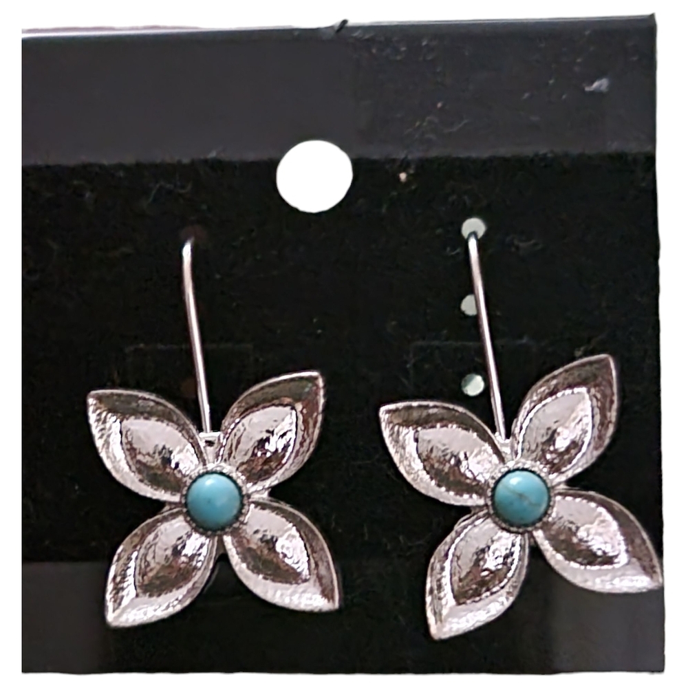 Silver-toned flower dangle earrings with a turquoise stone in the center